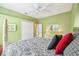Bright bedroom featuring a paisley bedspread, soft carpet, and convenient closet and ensuite access at 13524 Glynshel Dr, Winter Garden, FL 34787