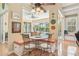 Cozy breakfast nook with built-in seating, a view of the pool, and natural light at 13524 Glynshel Dr, Winter Garden, FL 34787
