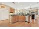 Open concept kitchen with stainless steel appliances, ample counter space, and a view into the living area at 13524 Glynshel Dr, Winter Garden, FL 34787