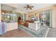 Covered lanai featuring tile flooring, comfortable seating, and views of the outdoor area at 13524 Glynshel Dr, Winter Garden, FL 34787