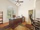 Comfortable home office with large window, stylish desk, ceiling fan, and modern fixtures at 13524 Glynshel Dr, Winter Garden, FL 34787