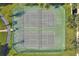 Aerial shot of community tennis courts, showing the layout and well-maintained green playing surfaces at 13524 Glynshel Dr, Winter Garden, FL 34787