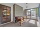 Enclosed sunroom featuring multiple windows and natural light, as well as access to an exterior door at 1387 Sawgrass Court, Winter Park, FL 32792