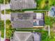 Birds eye view of a home with solar panels, screened-in patio, and fenced backyard with a pool at 14617 Keelford Way, Orlando, FL 32824