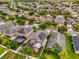 Overhead shot of a community with similar homes, many of which have solar panels and screened-in patios at 14617 Keelford Way, Orlando, FL 32824