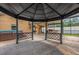 A screened patio featuring a gazebo, outdoor grill, and hot tub at 14617 Keelford Way, Orlando, FL 32824