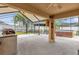 A screened patio featuring a gazebo, outdoor grill, and hot tub at 14617 Keelford Way, Orlando, FL 32824