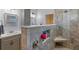 Nicely appointed bathroom featuring walk-in shower with built-in shelving and gray tiled surround at 14651 Pine Cone Trl, Clermont, FL 34711