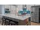 Spacious kitchen featuring a large island, stainless steel appliances, and ample counter space at 14651 Pine Cone Trl, Clermont, FL 34711
