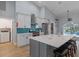 Spacious kitchen featuring a large island, stainless steel appliances, and ample counter space at 14651 Pine Cone Trl, Clermont, FL 34711