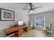 Bright home office with desk, computer, and a comfortable chair at 14651 Pine Cone Trl, Clermont, FL 34711