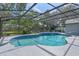 Large screened pool with spa, providing a serene and private outdoor oasis at 14651 Pine Cone Trl, Clermont, FL 34711
