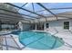 Beautiful screened pool with patio area, perfect for relaxation and outdoor enjoyment at 14651 Pine Cone Trl, Clermont, FL 34711