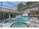 Stunning screened pool with hot tub and ample deck space for lounging and entertaining at 14651 Pine Cone Trl, Clermont, FL 34711