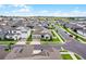 Wide aerial perspective of a residential neighborhood with well-manicured landscaping and community amenities at 15161 Lake Bessie Loop, Winter Garden, FL 34787