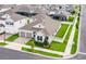 An aerial view of a pristine single-Gathering home featuring a manicured lawn and a spacious two-car garage at 15161 Lake Bessie Loop, Winter Garden, FL 34787