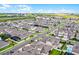 Panoramic aerial view of a vibrant neighborhood with modern homes, landscaping, and community amenities at 15161 Lake Bessie Loop, Winter Garden, FL 34787