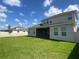 A well-maintained backyard enclosed by a white privacy fence at 15161 Lake Bessie Loop, Winter Garden, FL 34787