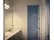 Bathroom featuring a dual-sink vanity and tub with shower at 15161 Lake Bessie Loop, Winter Garden, FL 34787