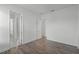 Bright bedroom with hardwood floors and multiple doorways at 15161 Lake Bessie Loop, Winter Garden, FL 34787