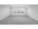 Bright bedroom with three windows for natural light at 15161 Lake Bessie Loop, Winter Garden, FL 34787