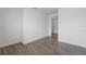 Bedroom features hardwood floors and neutral paint on the walls with base molding at 15161 Lake Bessie Loop, Winter Garden, FL 34787