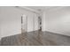 Spacious bedroom features modern flooring and multiple doorways at 15161 Lake Bessie Loop, Winter Garden, FL 34787