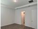 Bright bedroom with neutral walls, tray ceiling, and wood-look floors at 15161 Lake Bessie Loop, Winter Garden, FL 34787