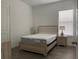 Bedroom with contemporary furnishings, wood-look floors, and natural light at 15161 Lake Bessie Loop, Winter Garden, FL 34787