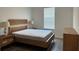 Bedroom with light wood furnishings and wood-look floors at 15161 Lake Bessie Loop, Winter Garden, FL 34787