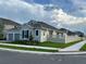 Charming single-story home with a well-manicured lawn and a two-car garage in a peaceful neighborhood at 15161 Lake Bessie Loop, Winter Garden, FL 34787
