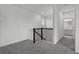 Upstairs landing area shows the staircase with black iron railing at 15161 Lake Bessie Loop, Winter Garden, FL 34787