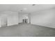 Upstairs hallway showcases neutral carpeting and a staircase at 15161 Lake Bessie Loop, Winter Garden, FL 34787