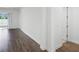 Bright living room features dark wood floors and sliding glass doors to the outside at 15161 Lake Bessie Loop, Winter Garden, FL 34787