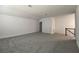 Large carpeted bonus room offering flexible living space and an entry door at 15161 Lake Bessie Loop, Winter Garden, FL 34787