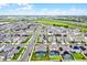 Wide aerial shot showcasing homes in a community, some with pools, bordered by a distinct red outline at 15161 Lake Bessie Loop, Winter Garden, FL 34787
