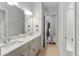 Traditional bathroom with double sinks and a view into another room at 15698 Panther Lake Dr, Winter Garden, FL 34787