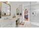 Bright bathroom with double sinks, vanity and a glass door shower at 15698 Panther Lake Dr, Winter Garden, FL 34787