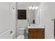Bright bathroom with vanity, mirror, and shelving for storage and organization at 15698 Panther Lake Dr, Winter Garden, FL 34787