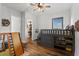A room with a playful design includes a bunk bed with storage and a slide at 15698 Panther Lake Dr, Winter Garden, FL 34787