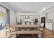 Bright kitchen and dining area boasting an oversized table and stylish pendant lighting at 15698 Panther Lake Dr, Winter Garden, FL 34787