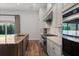 Spacious kitchen featuring marble countertops, a gas range, stainless appliances, and hardwood flooring at 15698 Panther Lake Dr, Winter Garden, FL 34787