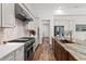 Gourmet kitchen featuring stainless steel appliances, gas range, marble countertops, and designer backsplash at 15698 Panther Lake Dr, Winter Garden, FL 34787