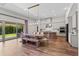 Open concept kitchen and dining area with modern appliances and sliding glass doors at 15698 Panther Lake Dr, Winter Garden, FL 34787