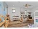 Spacious playroom with hardwood floors and toys, dollhouses, and decorative hot air balloon wall at 15698 Panther Lake Dr, Winter Garden, FL 34787