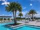 Upscale community pool area featuring splash fountains, pergola, and comfortable seating at 15698 Panther Lake Dr, Winter Garden, FL 34787