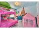 Charming bedroom featuring creative murals and a themed decor, ideal for imaginative play and comfort at 1615 Sanibel Dr, Davenport, FL 33896