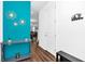 Bright entryway showcasing wood floors, modern decor, and stylish accents on a colorful wall at 1615 Sanibel Dr, Davenport, FL 33896