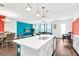 Bright, open kitchen with island, modern appliances, and seamless flow to the living and dining areas at 1615 Sanibel Dr, Davenport, FL 33896