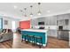 Stylish kitchen featuring modern appliances, a center island with bar seating, and sleek cabinetry at 1615 Sanibel Dr, Davenport, FL 33896